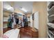 Spacious walk-in closet with custom shelves and storage solutions for shoes, clothing, and accessories at 5806 Terncrest Dr, Lithia, FL 33547