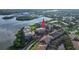 Aerial view of waterfront condos featuring mature trees and beautiful bay views at 600 Reserve Ln, Dunedin, FL 34698