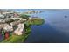 Stunning aerial view of waterfront condos with amazing water views, located in a lush green community at 600 Reserve Ln, Dunedin, FL 34698