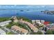 Aerial view of waterfront condos with lush landscaping and beautiful bay views at 600 Reserve Ln, Dunedin, FL 34698