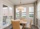 Dining room with chandelier, water views, and elegant chairs at 600 Reserve Ln, Dunedin, FL 34698