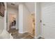 Welcoming hallway with staircase and access to office space at 600 Reserve Ln, Dunedin, FL 34698