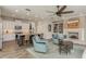 Spacious open-plan living area with kitchen, living room, and fireplace at 600 Reserve Ln, Dunedin, FL 34698
