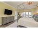 Main bedroom featuring natural lighting, wood-look flooring, and a view from the balcony at 600 Reserve Ln, Dunedin, FL 34698