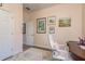 Home office featuring wood-look floors, artwork, and natural lighting at 600 Reserve Ln, Dunedin, FL 34698