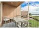 Balcony with seating area overlooking lush greenery and beautiful waterfront at 600 Reserve Ln, Dunedin, FL 34698