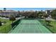 Overhead view of well-maintained tennis courts in a serene residential community at 600 Reserve Ln, Dunedin, FL 34698
