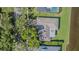 Birds-eye view of a home with beautiful landscaping, a well-manicured lawn, and waterfront access at 601 Riviera Bay Ne Dr, St Petersburg, FL 33702