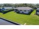 Lush green backyard featuring waterfront access and well-maintained landscaping at 601 Riviera Bay Ne Dr, St Petersburg, FL 33702