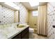 Bathroom featuring floral wallpaper, and a shower and tub combo with a neutral colored curtain at 601 Riviera Bay Ne Dr, St Petersburg, FL 33702