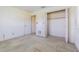 Bedroom featuring a double closet with shelving and neutral walls ready for customization at 601 Riviera Bay Ne Dr, St Petersburg, FL 33702