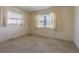 Bedroom with large windows letting in lots of light and plush carpeting at 601 Riviera Bay Ne Dr, St Petersburg, FL 33702