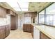 Spacious kitchen with wood cabinets and tile flooring at 601 Riviera Bay Ne Dr, St Petersburg, FL 33702