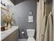 Cozy bathroom featuring a vanity with neutral colors and decor, and framed wall art at 6262 142Nd N Ave # 1106, Clearwater, FL 33760