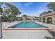 Inviting community pool with ample deck space for lounging under the beautiful blue sky at 6262 142Nd N Ave # 1106, Clearwater, FL 33760