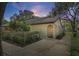 Charming home featuring stucco exterior and arched entryway with a private walkway at 6262 142Nd N Ave # 1106, Clearwater, FL 33760