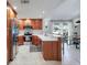 Bright kitchen with stainless steel appliances and breakfast bar seating at 6262 142Nd N Ave # 1106, Clearwater, FL 33760
