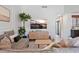 Inviting living room area featuring a comfortable couch and entertainment center at 6262 142Nd N Ave # 1106, Clearwater, FL 33760