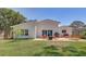 Beautiful backyard featuring an outdoor kitchen, seating, and a paver patio at 9100 2Nd N St, St Petersburg, FL 33702