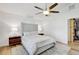 Bright bedroom featuring a ceiling fan, a plush bed, and ample closet space at 9100 2Nd N St, St Petersburg, FL 33702