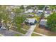 Aerial view showcasing the home's exterior, driveway, landscaping, neighborhood, and nearby streets at 940 57Th N Ave, St Petersburg, FL 33703