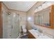Bathroom features tile walls, shower, vanity, and mirror at 940 57Th N Ave, St Petersburg, FL 33703