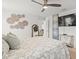 Inviting bedroom features a ceiling fan and decorative wall art at 9617 Branching Ship Trce, Wesley Chapel, FL 33545