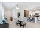 Chic dining area seamlessly connects to the kitchen and front entrance offering modern open-concept living at 9617 Branching Ship Trce, Wesley Chapel, FL 33545