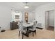 Inviting dining area with stylish chairs, modern table, and natural light, perfect for Gathering meals at 9617 Branching Ship Trce, Wesley Chapel, FL 33545