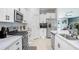 This well-equipped kitchen features stainless steel appliances and modern cabinetry, enhancing the home's appeal at 9617 Branching Ship Trce, Wesley Chapel, FL 33545