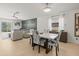 Cozy living room and dining area featuring modern decor, comfortable seating, and ample natural light at 9617 Branching Ship Trce, Wesley Chapel, FL 33545