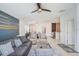 Inviting living room with a view of the kitchen, dining area, and abundant natural light at 9617 Branching Ship Trce, Wesley Chapel, FL 33545