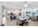 Open-concept living space combining a modern kitchen, dining area, and comfortable seating area at 9617 Branching Ship Trce, Wesley Chapel, FL 33545