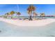 Rows of lounge chairs are on the community's beach area at 9617 Branching Ship Trce, Wesley Chapel, FL 33545