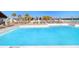 A luxurious pool with crystal clear water and many lounge chairs, perfect for relaxation and entertainment at 9617 Branching Ship Trce, Wesley Chapel, FL 33545