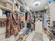 Spacious walk-in closet with custom shelving and ample storage space at 9617 Branching Ship Trce, Wesley Chapel, FL 33545