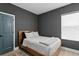 Bedroom featuring a gray accent wall and ensuite bathroom at 98 29Th S St, St Petersburg, FL 33712
