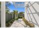 View of courtyard featuring a white pergola and brick patio at 98 29Th S St, St Petersburg, FL 33712