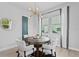 Cozy dining room featuring a chandelier, neutral decor and natural light at 98 29Th S St, St Petersburg, FL 33712