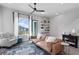 Cozy living room featuring a comfortable sofa, stylish rug, floating shelves, and ample natural light at 98 29Th S St, St Petersburg, FL 33712