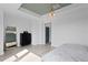 Spacious main bedroom with light wood floors, a modern dresser, and a stylish mirror at 98 29Th S St, St Petersburg, FL 33712