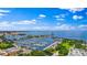 Stunning aerial view of the marina with boats and sparkling blue water under a partly cloudy sky at 100 1St N Ave # 1005, St Petersburg, FL 33701