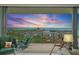 Relax on the balcony with comfortable seating and a telescope while enjoying the beautiful sunset water view at 100 1St N Ave # 1005, St Petersburg, FL 33701