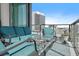 Comfortable balcony seating with a table, overlooking the cityscape at 100 1St N Ave # 1005, St Petersburg, FL 33701