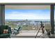Balcony with comfortable seating and stunning water views showcasing the horizon at 100 1St N Ave # 1005, St Petersburg, FL 33701