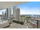 Condo balcony with seating, a potted plant, and a view of the city and water at 100 1St N Ave # 1005, St Petersburg, FL 33701
