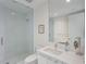 Modern bathroom featuring a glass shower, white vanity, and a sleek, minimalist design at 100 1St N Ave # 1005, St Petersburg, FL 33701