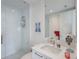 Modern bathroom featuring a glass-enclosed shower and sleek white vanity at 100 1St N Ave # 1005, St Petersburg, FL 33701