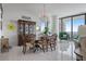 Bright dining room with large windows, chandelier, and seating for six at 100 1St N Ave # 1005, St Petersburg, FL 33701