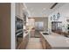 Gourmet kitchen featuring stainless steel appliances, custom cabinetry, and a large center island at 100 1St N Ave # 1005, St Petersburg, FL 33701